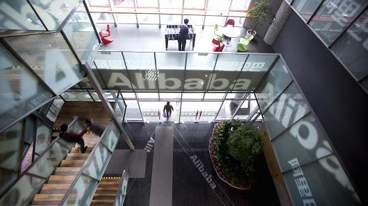 People walk through Alibaba.com Ltd.