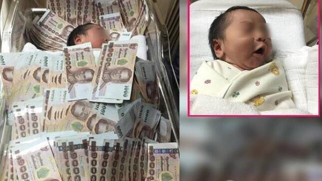 泰国土豪送婴儿40万现金 还给当被子盖